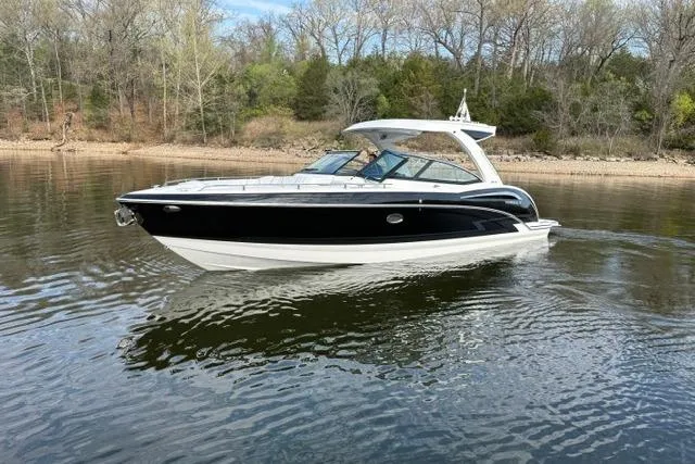 Slide: The Image of 2025 Formula 350 Crossover Bowrider I/O cruising on a calm lake. - 32