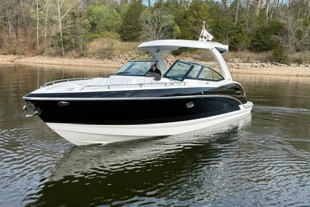 Slide: The Image of 2025 Formula 350 Crossover Bowrider I/O cruising on a calm lake. - 33