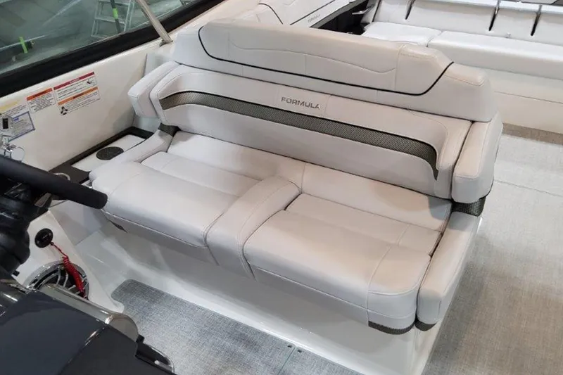 Slide: The Image of 2025 Formula 350 Crossover Bowrider I/O interior with luxurious white seating. - 5
