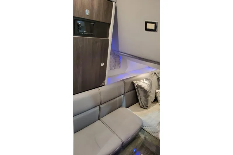 Slide: The Image of Interior of 2025 Formula 350 Crossover Bowrider I/O with modern seating and ambient lighting. - 7