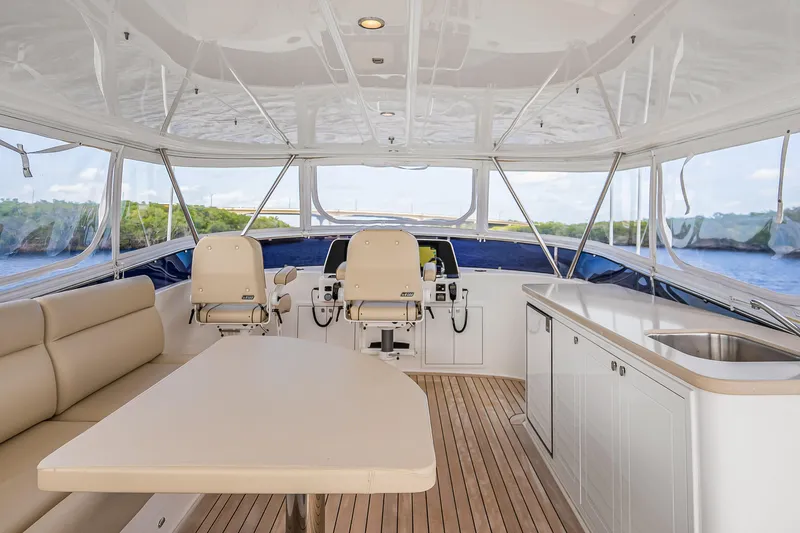 Slide: The Image of Luxurious interior of 2023 Grand Banks GB54 yacht with seating and helm station. - 27