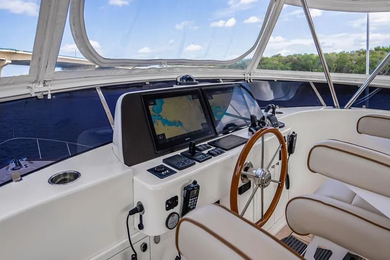Slide: The Image of 2023 Grand Banks GB54 yacht helm with navigation system and steering wheel. - 35
