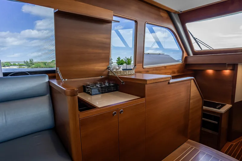 Slide: The Image of Luxurious interior of 2023 Grand Banks GB54 yacht with elegant wood finish and seating. - 42