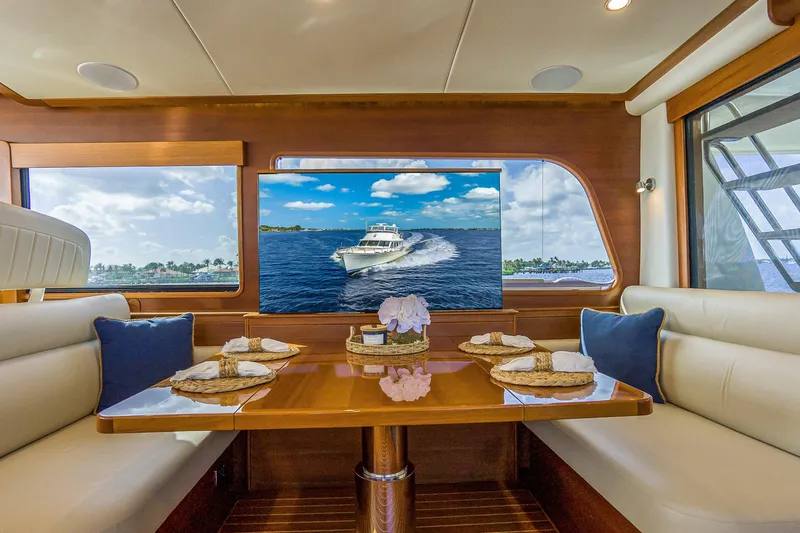 Slide: The Image of Luxurious 2023 Grand Banks GB54 yacht interior with elegant dining area and scenic ocean view. - 45