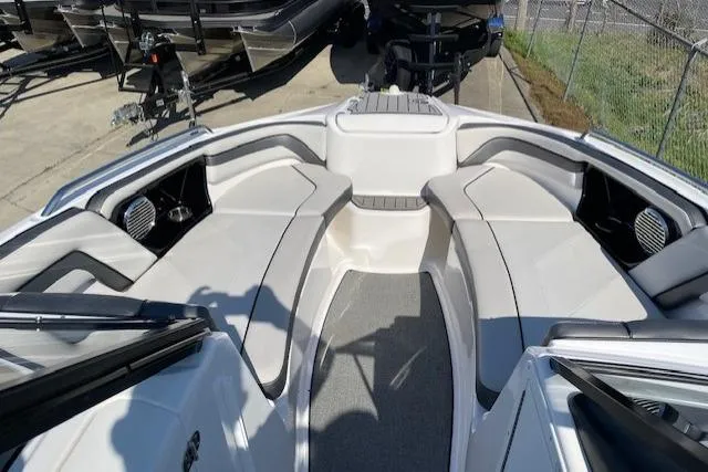Slide: The Image of 2019 Yamaha Boats AR240 interior with spacious seating and modern design. - 2