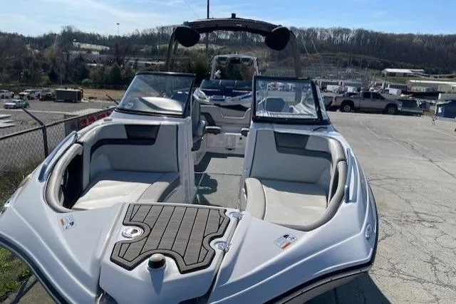 Slide: The Image of 2019 Yamaha Boats AR240 with open bow seating, parked outdoors. - 3