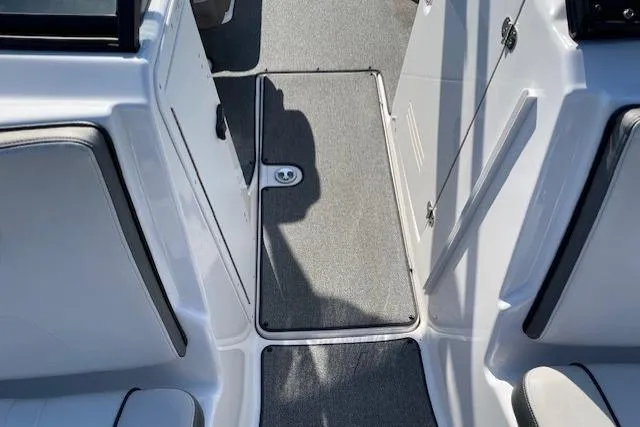 Slide: The Image of Interior view of 2019 Yamaha AR240 boat, featuring sleek seating and carpeted flooring. - 5