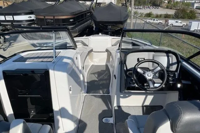 Slide: The Image of 2019 Yamaha Boats AR240 interior with steering wheel and seating area. - 7