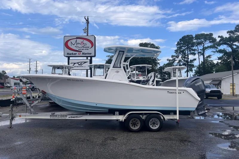 The Image of 2023 Tidewater 232 CC Adventure boat on trailer at Marker 17 Marine dealership. - 0