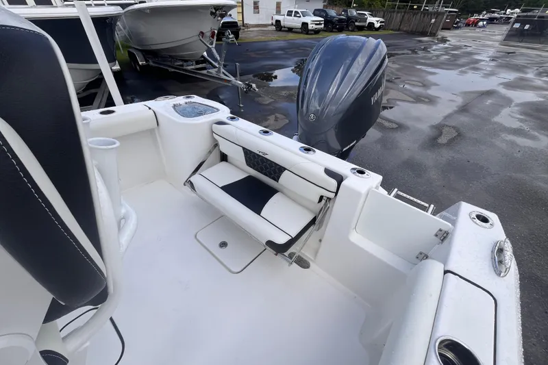 Slide: The Image of 2023 Tidewater 232 CC Adventure boat with Yamaha outboard engine, featuring sleek seating. - 13