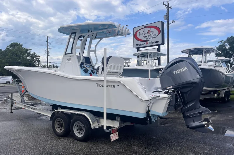 Slide: The Image of 2023 Tidewater 232 CC Adventure boat with Yamaha engine on trailer at dealership. - 2