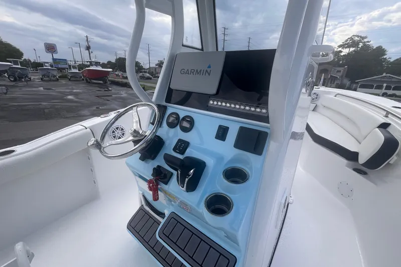 Slide: The Image of 2023 Tidewater 232 CC Adventure boat dashboard with Garmin navigation system. - 7