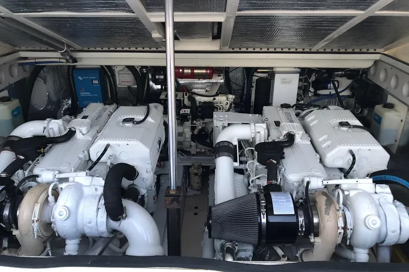 Slide: The Image of Engine room of a 2007 Carolina Classic 35 Express, showcasing dual marine engines. - 19
