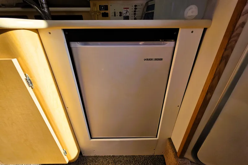 Slide: The Image of Compact Black & Decker fridge inside 2000 Bayliner 2858 Ciera Command Bridge boat cabin. - 10