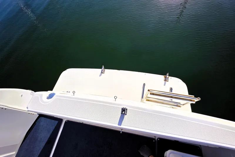 Slide: The Image of Bayliner 2858 Ciera Command Bridge 2000, view of swim platform over water. - 13