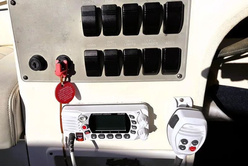 Slide: The Image of Control panel of a 2000 Bayliner 2858 Ciera Command Bridge with switches and radio. - 16