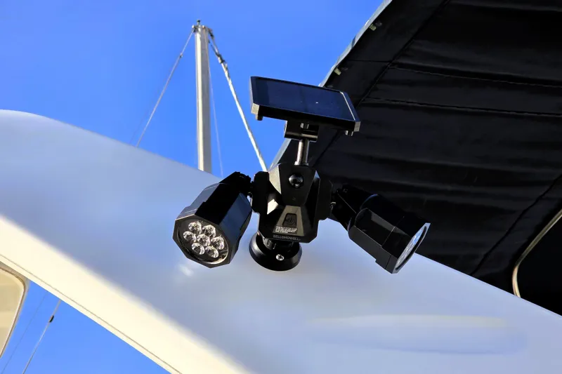 Slide: The Image of Solar-powered security lights on 2000 Bayliner 2858 Ciera Command Bridge against blue sky. - 24