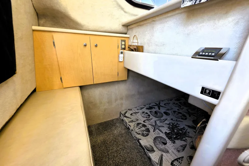 Slide: The Image of Interior cabin of 2000 Bayliner 2858 Ciera Command Bridge with storage and seating. - 29