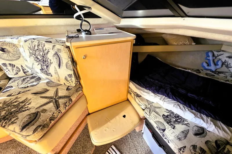 Slide: The Image of Interior cabin of 2000 Bayliner 2858 Ciera Command Bridge with nautical-themed decor. - 35