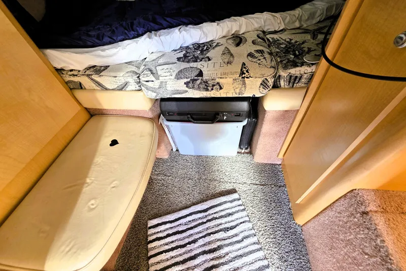 Slide: The Image of Interior of 2000 Bayliner 2858 Ciera Command Bridge with seating and compact fridge. - 37