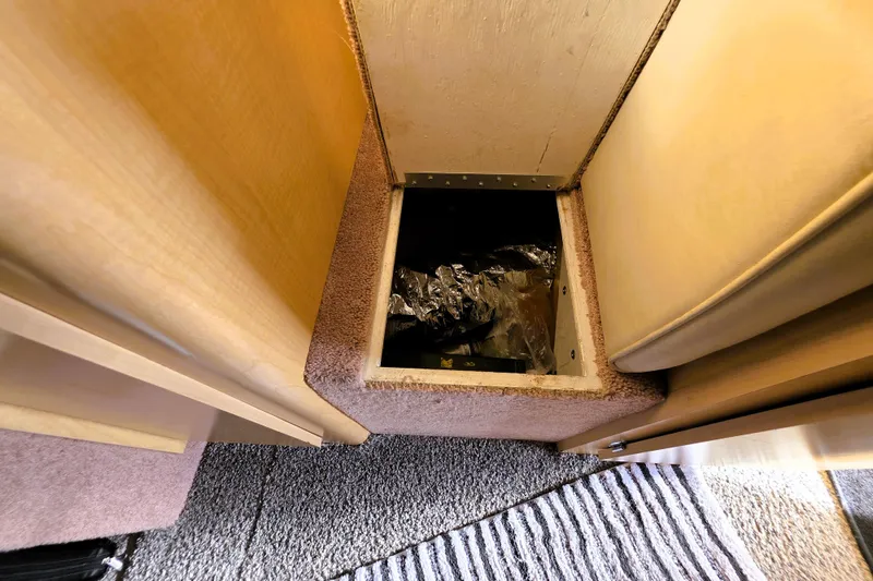 Slide: The Image of Storage compartment in 2000 Bayliner 2858 Ciera Command Bridge boat interior. - 38