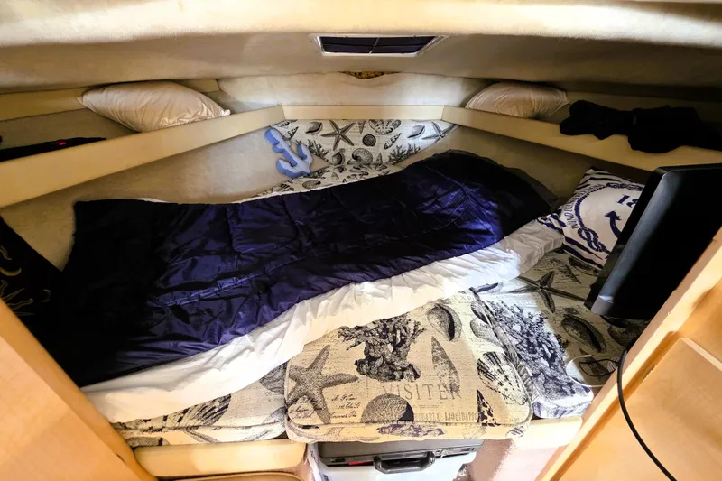 Slide: The Image of Cozy sleeping area in 2000 Bayliner 2858 Ciera Command Bridge boat cabin. - 4
