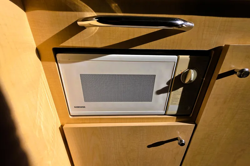 Slide: The Image of Built-in Samsung microwave in 2000 Bayliner 2858 Ciera Command Bridge kitchen. - 7