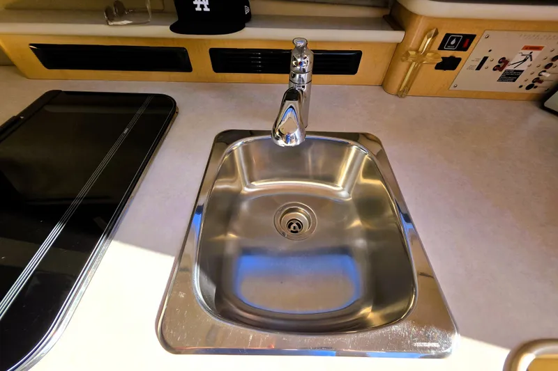 Slide: The Image of Stainless steel sink in 2000 Bayliner 2858 Ciera Command Bridge kitchen area. - 9