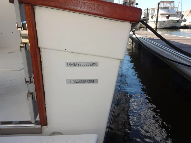 Slide: The Image of Stern of a 2016 North Aegean 30 boat at the dock. - 10