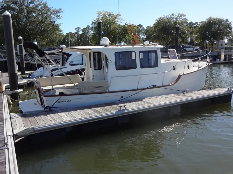 Slide: The Image of North Aegean 30 Trawler, 2016, docked at marina. - 13