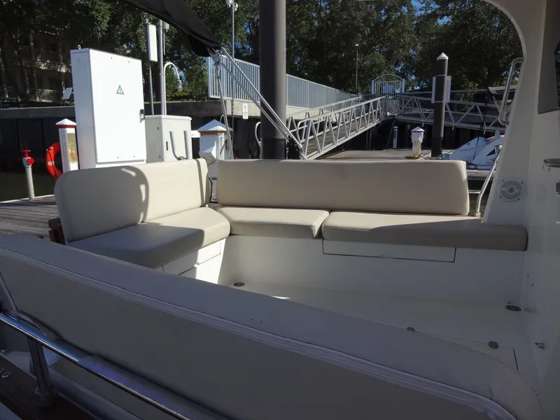 Slide: The Image of Interior of a 2016 North Aegean 30 yacht with beige seating. - 19