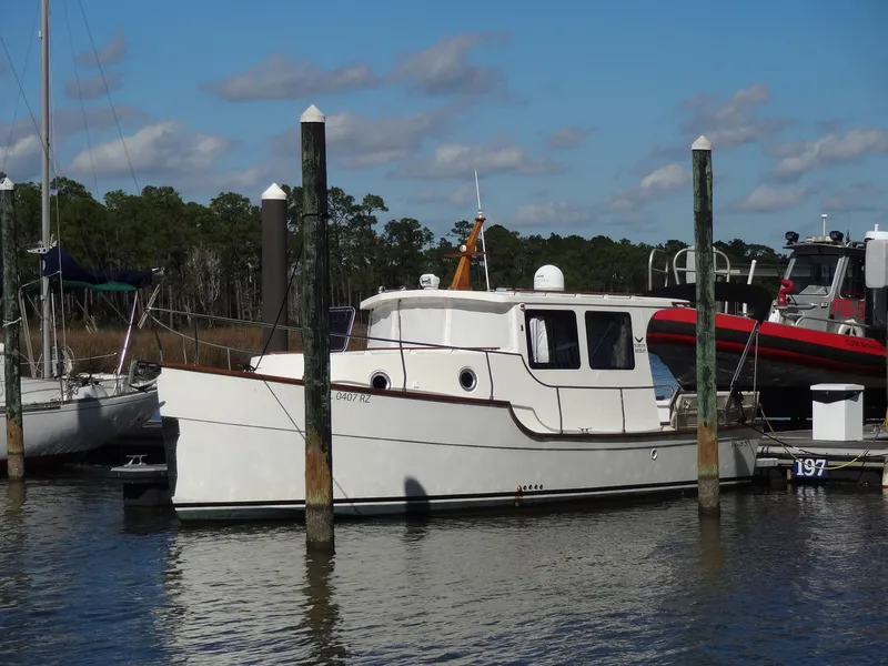 Slide: The Image of 2016 North Aegean 30 boat docked in harbor, sunny day. - 2