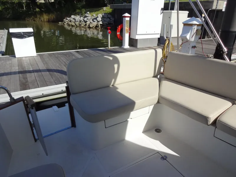 Slide: The Image of Interior of a 2016 North Aegean 30 yacht with beige seating. - 21