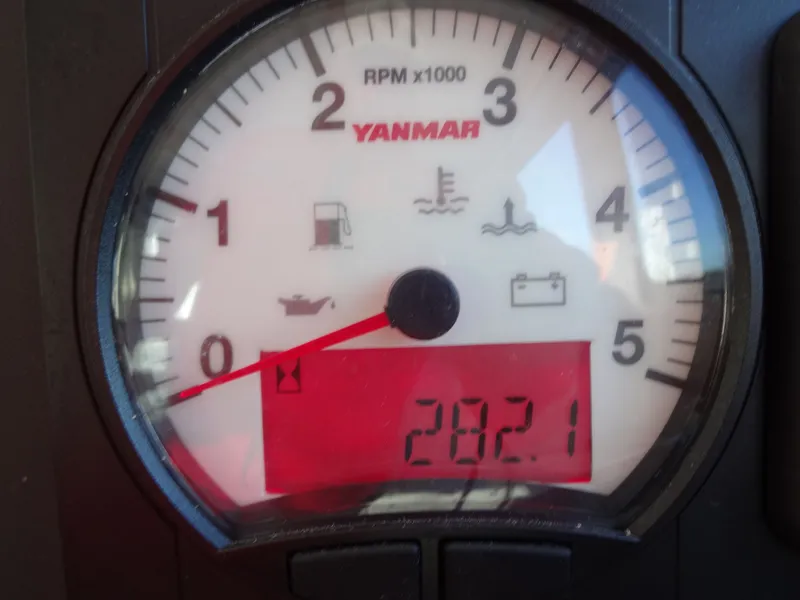 Slide: The Image of Yanmar tachometer on North Aegean 30 boat, displaying 2821 RPM. - 24