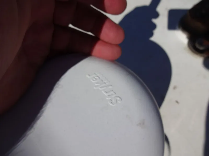 Slide: The Image of Hand holding white object labeled 'Sirius' on a boat. - 44