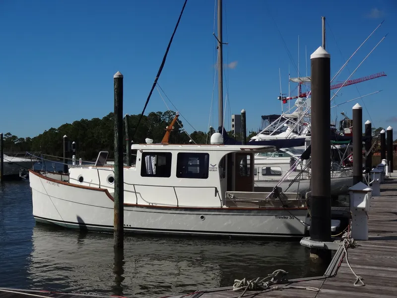 Slide: The Image of 2016 North Aegean 30 boat docked at marina. - 6
