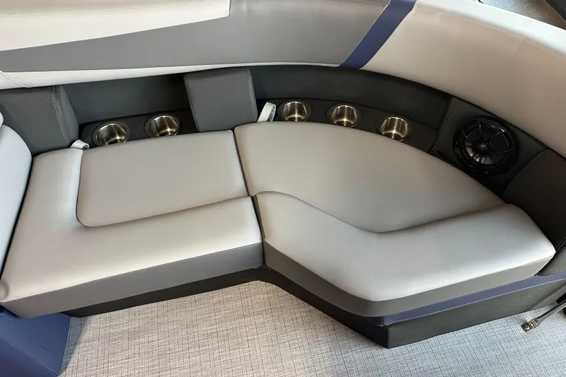 Slide: The Image of Luxurious seating area in 2025 Trifecta 24RFCS3 boat with cup holders and speaker. - 11