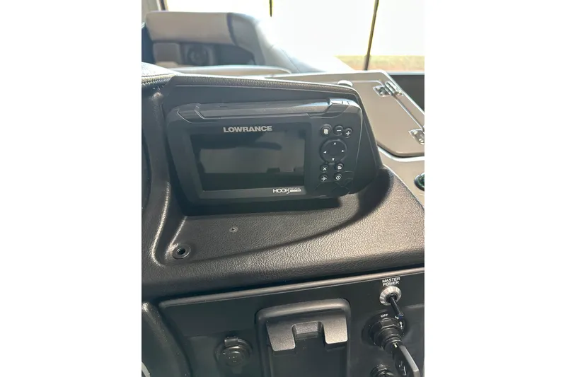 Slide: The Image of Lowrance fish finder on Trifecta 24RFCS3 boat dashboard, 2025 model. - 14