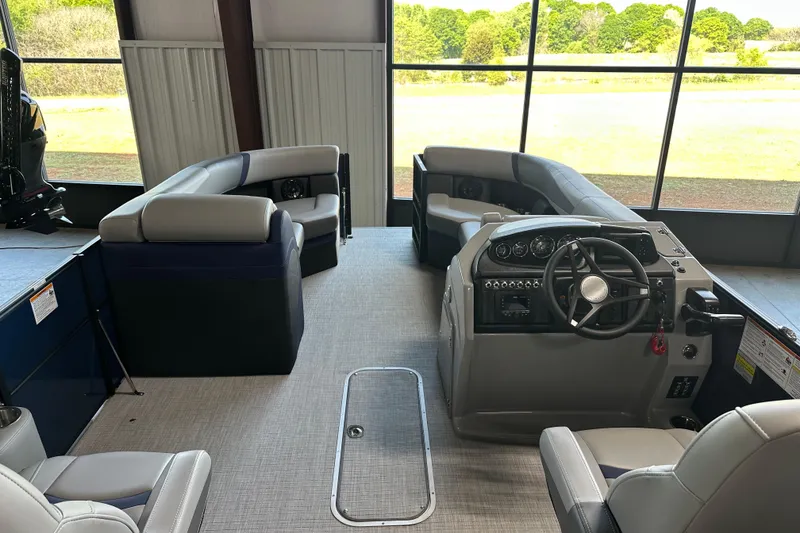 Slide: The Image of Interior of 2025 Trifecta 24RFCS3 pontoon boat with modern seating and control panel. - 8