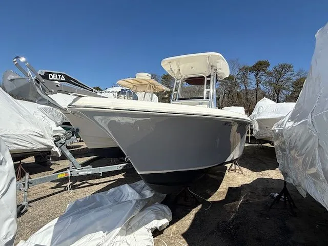 Slide: The Image of 2022 Key West 239 FS boat on a trailer outdoors. - 10