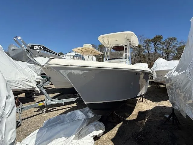 Slide: The Image of 2022 Key West 239 FS boat on a trailer outdoors. - 11