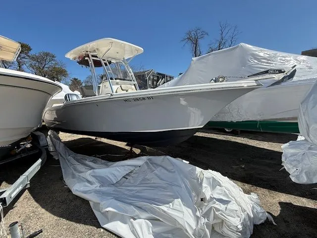 Slide: The Image of 2022 Key West 239 FS boat on a trailer outdoors. - 8