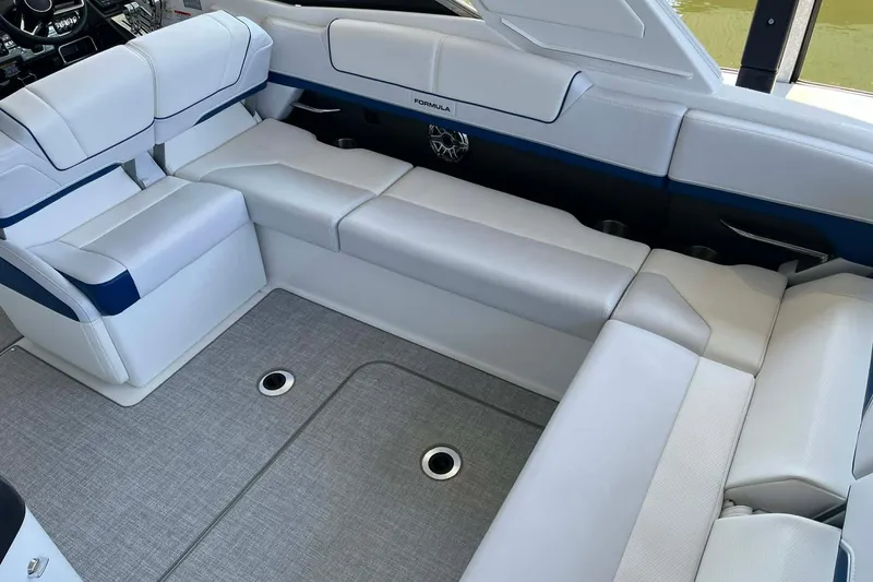 Slide: The Image of Luxurious interior of 2026 Formula 310 Bowrider I/O with plush white seating. - 16