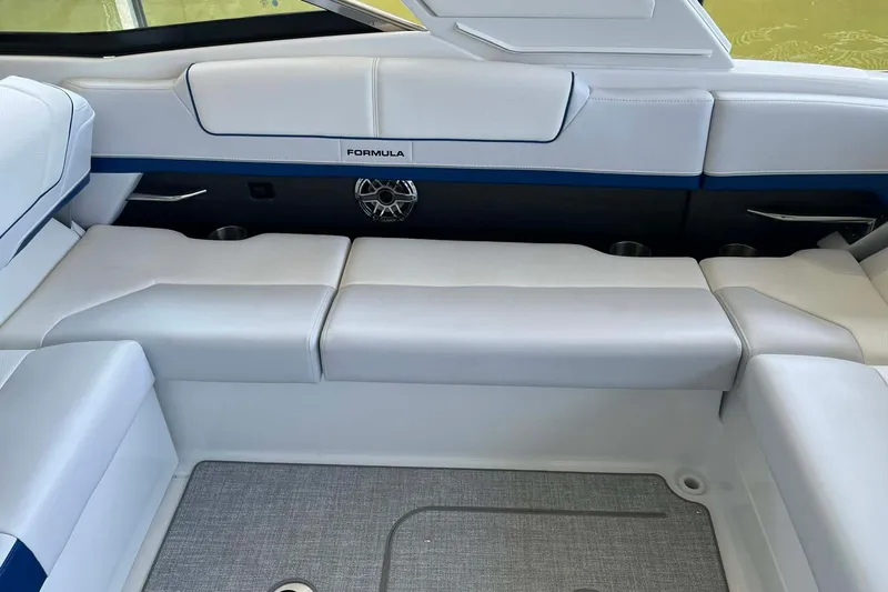 Slide: The Image of Luxurious seating in 2026 Formula 310 Bowrider I/O boat, featuring sleek white upholstery. - 17