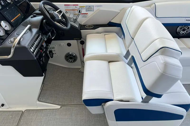 Slide: The Image of 2026 Formula 310 Bowrider I/O interior with modern dashboard and plush seating. - 21