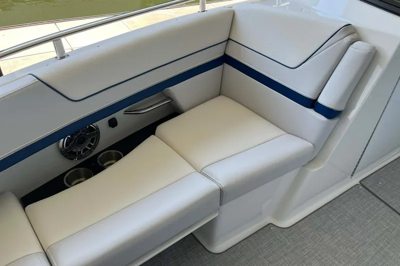 Slide: The Image of Luxurious seating on 2026 Formula 310 Bowrider I/O boat with cup holders and speaker. - 27