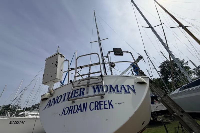 Slide: The Image of 1980 Hunter 37 Cherubini Cutter sailboat named "Another Woman" at Jordan Creek. - 12