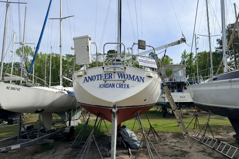 Slide: The Image of 1980 Hunter 37 Cherubini Cutter sailboat named "Another Woman" on land for sale. - 2