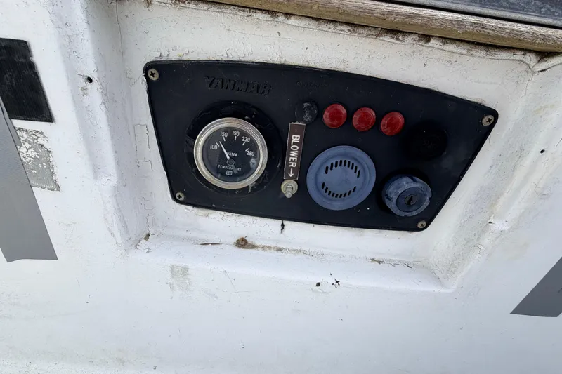 Slide: The Image of Control panel of a 1980 Hunter 37 Cherubini Cutter sailboat with gauges and switches. - 20