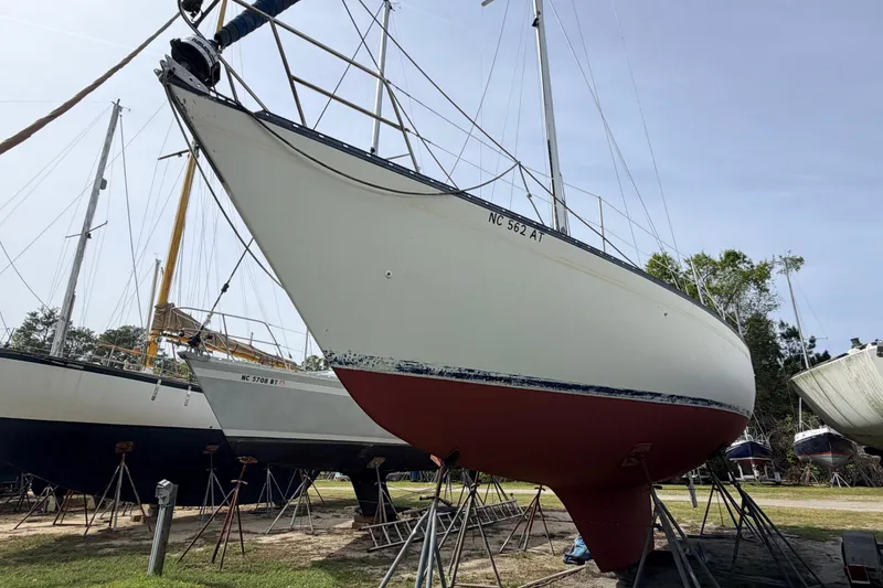 Slide: The Image of 1980 Hunter 37 Cherubini Cutter sailboat on stands, ready for maintenance. - 3